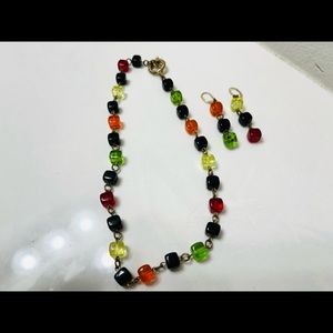 Handcrafted beaded necklace and earrings.